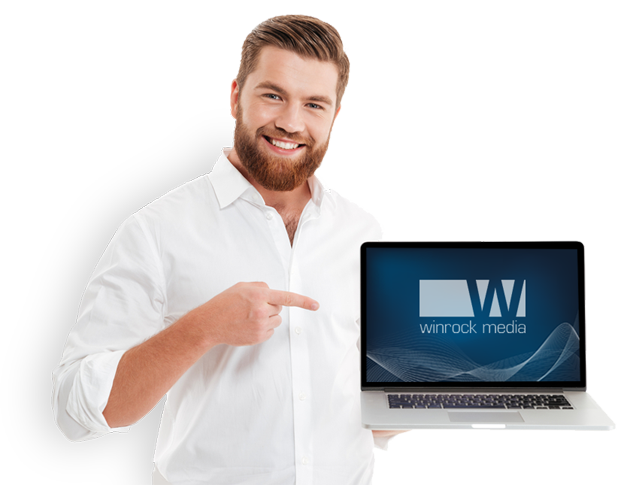 winrock media web designer showing website on laptop computer